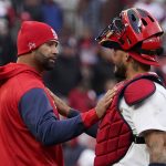 
              St. Louis Cardinals' Albert Pujols, left, and Yadier Molina celebrate a 9-0 victory over the Pittsburgh Pirates in a baseball game Thursday, April 7, 2022, in St. Louis. (AP Photo/Jeff Roberson)
            