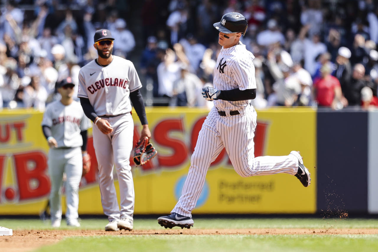 New York Yankees' Anthony Rizzo rounds the bases after Rizzo's home run as Cleveland Guardians shor...