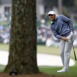 
              Scottie Scheffler watches his second shot on the first fairway during the third round of the Masters golf tournament at Augusta National on Saturday, April 9, 2022, in Augusta, Ga. (Curtis Compton/Atlanta Journal-Constitution via AP)
            