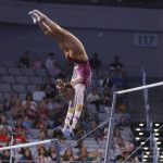 
              Oklahoma's Ragan Smith competes on the uneven bars during the NCAA college women's gymnastics championships, Saturday, April 16, 2022, in Fort Worth, Texas. (AP Photo/Gareth Patterson)
            