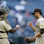 
              San Diego Padres catcher Jorge Alfaro (38) and Padres relief pitcher Javy Guerra (8) bump fists after a baseball game against the Arizona Diamondbacks Sunday, April 10, 2022, in Phoenix. The Padres won 10-5. (AP Photo/Ross D. Franklin)
            