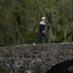 
              Cameron Smith, of Australia, walks over the Nelson Bridge during the second round at the Masters golf tournament on Friday, April 8, 2022, in Augusta, Ga. (AP Photo/Matt Slocum)
            