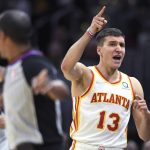 
              Atlanta Hawks' Bogdan Bogdanovic celebrates a turnover during the second half of the team's NBA play-in basketball game against the Cleveland Cavaliers on Friday, April 15, 2022, in Cleveland. (AP Photo/Nick Cammett)
            
