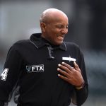 
              Home plate umpire CB Bucknor reacts after being hit by a pitch before the Boston Red Sox-Detroit Tigers baseball game in Detroit, Wednesday, April 13, 2022. (AP Photo/Paul Sancya)
            