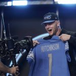 
              Michigan defensive end Aidan Hutchinson celebrates being selected by the Detroit Lions as the second pick in the NFL football draft Thursday, April 28, 2022, in Las Vegas. (AP Photo/John Locher )
            
