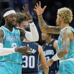 
              Charlotte Hornets center Montrezl Harrell, left, celebrates a basket with teammate Kelly Oubre Jr., right, during the first half of an NBA basketball game against the Orlando Magic on Thursday, April 7, 2022, in Charlotte, N.C. (AP Photo/Rusty Jones)
            