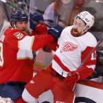 
              Florida Panthers center Joe Thornton (19) hits Detroit Red Wings defenseman Filip Hronek (17) into the boards during the second period of an NHL hockey game Thursday, April 21, 2022, in Sunrise, Fla. (AP Photo/Reinhold Matay)
            