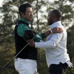 
              Hideki Matsuyama, of Japan, greets Harold Varner III on the 18th green during the third round at the Masters golf tournament on Saturday, April 9, 2022, in Augusta, Ga. (AP Photo/David J. Phillip)
            
