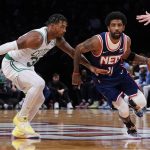 
              Brooklyn Nets guard Kyrie Irving (11) drives past Boston Celtics guard Marcus Smart, left, during the first half of Game 4 of an NBA basketball first-round playoff series, Monday, April 25, 2022, in New York. (AP Photo/John Minchillo)
            