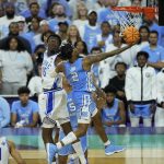 
              North Carolina guard Caleb Love (2) shoots against Duke center Mark Williams (15) during the second half of a college basketball game in the semifinal round of the Men's Final Four NCAA tournament, Saturday, April 2, 2022, in New Orleans. (AP Photo/Gerald Herbert)
            