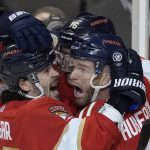 
              Florida Panthers left wing Jonathan Huberdeau, right, celebrates with teammates after scoring in overtime of the team's NHL hockey game against the Toronto Maple Leafs, Tuesday, April 5, 2022, in Sunrise, Fla. (AP Photo/Rebecca Blackwell)
            