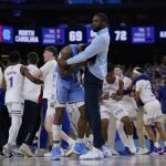 
              North Carolina guard Caleb Love reacts to a loss against Kansas after a college basketball game in the finals of the Men's Final Four NCAA tournament, Monday, April 4, 2022, in New Orleans. Kansas won 72-69. (AP Photo/David J. Phillip)
            