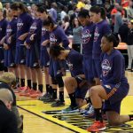 
              FILE - Phoenix Mercury's Kelsey Bone, right, and Mistie Bass, second from right, kneel during the playing of the national anthem before the start of a first round WNBA playoff basketball game against the Indiana Fever, Wednesday, Sept. 21, 2016, in Indianapolis. (AP Photo/Darron Cummings, File)
            