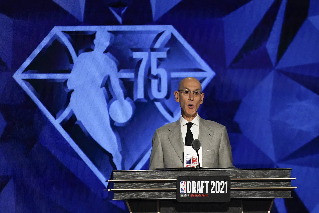 FILE - NBA Commissioner Adam Silver speaks at the start of the NBA basketball draft, July 29, 2021,...