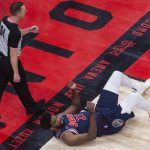
              Philadelphia 76ers Joel Embiid lies at the feet of referee Justin Van Duyne after being fouled by Toronto Raptors' Khem Birch during the second half of Game 3 of an NBA basketball first-round playoff series, Wednesday, April 20, 2022, in Toronto. (Chris Young/The Canadian Press via AP)
            