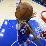 
              Philadelphia 76ers' Tobias Harris (12) goes up for a shot past Toronto Raptors' Pascal Siakam (43) during the first half of Game 5 in an NBA basketball first-round playoff series, Monday, April 25, 2022, in Philadelphia. (AP Photo/Matt Slocum)
            