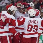 
              Detroit Red Wings' Moritz Seider, center, celebrates his goal with teammates during the second period of an NHL hockey game against the New Jersey Devils in Newark, N.J., Friday, April 29, 2022. (AP Photo/Seth Wenig)
            