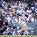 
              Los Angeles Dodgers' Cody Bellinger follows through on an RBI triple during the sixth inning of a baseball game against the Atlanta Braves Wednesday, April 20, 2022, in Los Angeles. (AP Photo/Marcio Jose Sanchez)
            