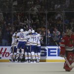 
              Chicago Blackhawks goaltender Collin Delia (60) skates off the ice as Buffalo Sabres players celebrate a goal by center Casey Mittelstadt during overtime in an NHL hockey game Friday, April 29, 2022, in Buffalo, N.Y. (AP Photo/Joshua Bessex)
            