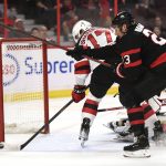 
              New Jersey Devils center Yegor Sharangovich (17) doesn't score as Ottawa Senators defenseman Travis Hamonic (23) defends during the first period of an NHL hockey game in Ottawa, on Tuesday, April 26, 2022. (Justin Tang/The Canadian Press via AP)
            