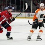 
              Philadelphia Flyers right wing Bobby Brink right, and Washington Capitals center Lars Eller (20) skate on the ice in the first period of an NHL hockey game, Tuesday, April 12, 2022, in Washington. It is Brink's first game in the league. (AP Photo/Alex Brandon)
            