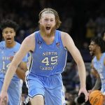 
              North Carolina's Brady Manek (45) celebrates after beating Duke in a college basketball game during the semifinal round of the Men's Final Four NCAA tournament, Saturday, April 2, 2022, in New Orleans. (AP Photo/David J. Phillip)
            