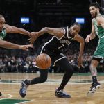 
              Brooklyn Nets' Kevin Durant, center, vies for the ball with Boston Celtics' Al Horford (42) and Jayson Tatum (0) during the first half of Game 2 of an NBA basketball first-round Eastern Conference playoff series, Wednesday, April 20, 2022, in Boston. (AP Photo/Michael Dwyer)
            
