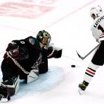 
              Arizona Coyotes goaltender Karel Vejmelka, left, slides over to make a save on a shot by Chicago Blackhawks left wing Boris Katchouk (14) during the first period of an NHL hockey game Wednesday, April 20, 2022, in Glendale, Ariz. (AP Photo/Ross D. Franklin)
            