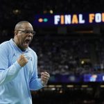 
              FILE - North Carolina head coach Hubert Davis reacts against Kansas during the first half of a college basketball game in the finals of the men's Final Four NCAA tournament, Monday, April 4, 2022, in New Orleans. Davis led the Tar Heels to the NCAA title game in his first season as the successor to Roy William. (AP Photo/Brynn Anderson, File)
            