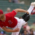 
              Los Angeles Angels starting pitcher Noah Syndergaard throws against the Oakland Athletics during the first inning of a spring training baseball game, Monday, March 28, 2022, in Tempe, Ariz. (AP Photo/Matt York)
            