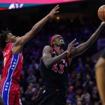 
              Toronto Raptors' Pascal Siakam, center, goes up for a shot past Philadelphia 76ers' Tyrese Maxey, left, during the first half of Game 2 of an NBA basketball first-round playoff series, Monday, April 18, 2022, in Philadelphia. (AP Photo/Matt Slocum)
            