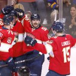 
              Florida Panthers left wing Mason Marchment (17), right wing Patric Hornqvist (70), center Anton Lundell (15) congratulate defenseman MacKenzie Weegar (52) on his goal during the second period of an NHL hockey game against the Detroit Red Wings, Thursday, April 21, 2022, in Sunrise, Fla. (AP Photo/Reinhold Matay)
            
