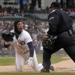 
              Detroit Tigers' Javier Baez reacts to the call by home plate umpire Adrian Johnson during the sixth inning of a baseball game against the Chicago White Sox, Saturday, April 9, 2022, in Detroit. (AP Photo/Carlos Osorio)
            