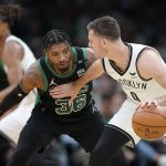 
              Boston Celtics guard Marcus Smart (36) defends as Brooklyn Nets guard Goran Dragic, of Slovenia, right, looks for an opening in the first half of Game 1 of an NBA basketball first-round Eastern Conference playoff series, Sunday, April 17, 2022, in Boston. The Celtics won 115-114. (AP Photo/Steven Senne)
            