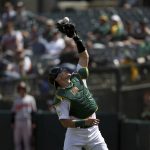 
              Oakland Athletics catcher Sean Murphy (12) catches a popup hit by Baltimore Orioles' Ramon Urias during the seventh inning of a baseball game in Oakland, Calif., Thursday, April 21, 2022. (AP Photo/Jed Jacobsohn)
            