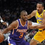 
              Los Angeles Lakers guard Avery Bradley fouls Phoenix Suns guard Chris Paul (3) during the second half of an NBA basketball game Tuesday, April 5, 2022, in Phoenix. The Suns won 121-110. (AP Photo/Rick Scuteri)
            
