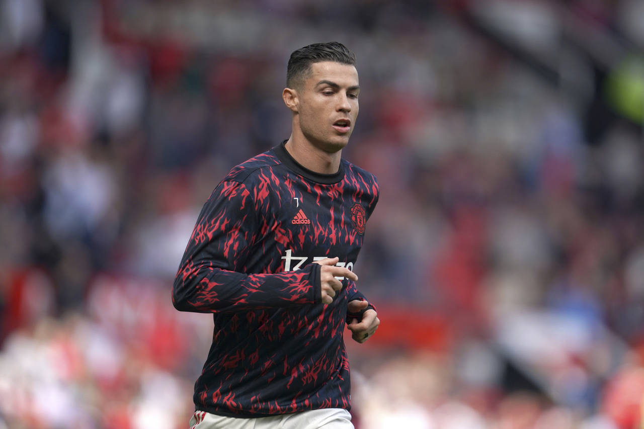 Manchester United's Cristiano Ronaldo warms up before the English Premier League soccer match betwe...
