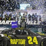 
              William Byron (24) is showered with confetti in Victory Lane after he won the NASCAR Cup Series auto race at Martinsville Speedway on Saturday, April 9, 2022, in Martinsville, Va. (AP Photo/Steve Helber)
            