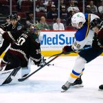 
              St. Louis Blues center Logan Brown (22) scores a goal against Arizona Coyotes goaltender Harri Sateri (30) as Coyotes center Nathan Smith, right, defends and defenseman Cam Dineen (54) watches during the second period of an NHL hockey game Saturday, April 23, 2022, in Glendale, Ariz. (AP Photo/Ross D. Franklin)
            