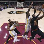 
              FILE - Cleveland Cavaliers' LeBron James shoots during the first half of Game 4 of basketball's NBA Finals against the Golden State Warriors, June 8, 2018, in Cleveland. (Gregory Shamus/Pool Photo via AP, File)
            