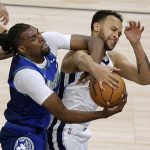 
              Minnesota Timberwolves center Naz Reid, left, and Memphis Grizzlies forward Kyle Anderson struggle for a rebound during the second half in Game 3 of an NBA basketball first-round playoff series Thursday, April 21, 2022, in Minneapolis. (AP Photo/Andy Clayton-King)
            