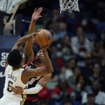 
              New Orleans Pelicans forward Herbert Jones (5) goes to the basket against Portland Trail Blazers guard Brandon Williams (8) in the first half of an NBA basketball game in New Orleans, Thursday, April 7, 2022. (AP Photo/Gerald Herbert)
            