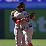 
              San Francisco Giants second basemen Thairo Estrada, right, is congratulated by shortstop Brandon Crawford after the Giants defeated the Cleveland Guardians 8-1 in a baseball game, Sunday, April 17, 2022, in Cleveland. (AP Photo/David Dermer)
            