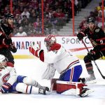 
              Montreal Canadiens goaltender Carey Price (31) makes a glove save as defenseman Chris Wideman (20) and Ottawa Senators right wing Drake Batherson (19) and center Josh Norris (9) watch during the second period of an NHL hockey game Saturday, April 23, 2022, in Ottawa, Ontario. (Justin Tang/The Canadian Press via AP)
            