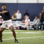 
              Liberty quarterback Malik Willis throws during the school's pro football day for NFL scouts and coaches, Tuesday, March 22, 2022, in Lynchburg, Va. (AP Photo/Kendall Warner)
            