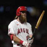 
              Los Angeles Angels' Brandon Marsh breaks his bat as he pops out during the sixth inning of the team's baseball game against the Houston Astros on Friday, April 8, 2022, in Anaheim, Calif. (AP Photo/Marcio Jose Sanchez)
            