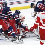 
              Detroit Red Wings goaltender Thomas Greiss (29) goes down to cover up the shot from Winnipeg Jets' Josh Morrissey (44) during the first period of an NHL hockey game Wednesday, April 6, 2022, in Winnipeg, Manitoba. (John Woods/The Canadian Press via AP)
            