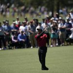 
              Tiger Woods watches his shot on ninth hole during the final round at the Masters golf tournament on Sunday, April 10, 2022, in Augusta, Ga. (AP Photo/David J. Phillip)
            