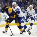 
              Nashville Predators center Matt Duchene (95) and Tampa Bay Lightning defenseman Erik Cernak (81) battle for the puck during the first period of an NHL hockey game Saturday, April 23, 2022, in Tampa, Fla. Looking on is Lightning's Victor Hedman (77). (AP Photo/Chris O'Meara)
            