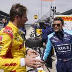 
              Romain Grosjean, of France, left, talks with Marco Andretti during IndyCar auto racing testing at Indianapolis Motor Speedway, Wednesday, April 20, 2022, in Indianapolis. (AP Photo/Darron Cummings)
            